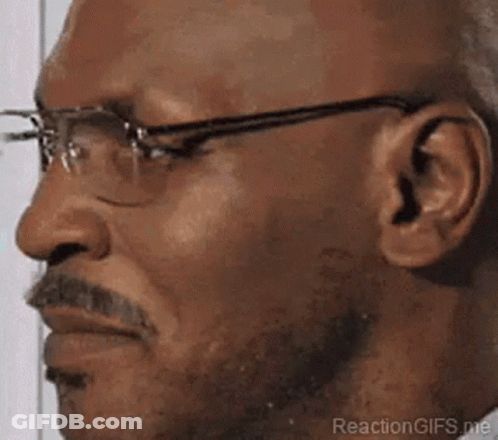 A Close Up Of A Man Wearing Glasses And A Beard . GIF