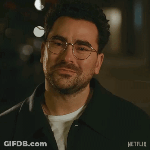 A Close Up Of A Man Wearing Glasses And A Netflix Logo GIF