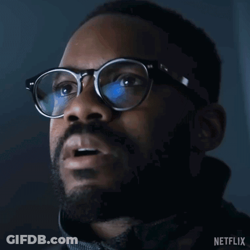 Close-Up Of Man Wearing Glasses And Netflix Logo GIF