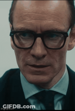 A Close Up Of A Man Wearing Glasses And A Suit With Imgflip.com At The Bottom GIF