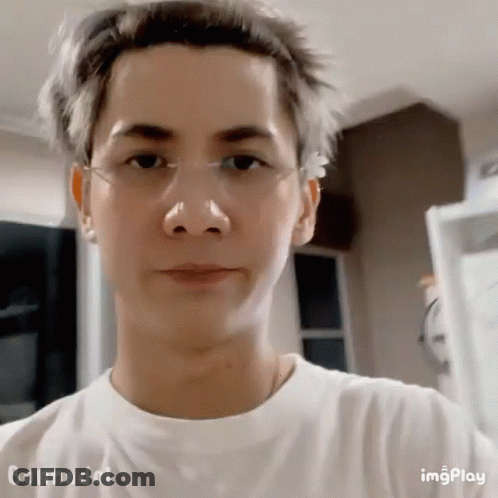 A Close Up Of A Man Wearing Glasses And A White Shirt GIF
