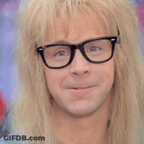 A Close Up Of A Man Wearing Glasses And A Wig GIF