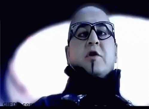 A Close Up Of A Man Wearing Glasses And Headphones . GIF
