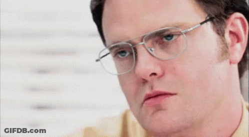 A Close Up Of A Man Wearing Glasses And Making A Funny Face GIF