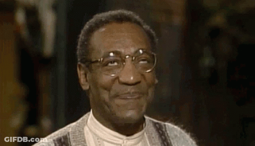 A Close Up Of A Man Wearing Glasses And Smiling . GIF