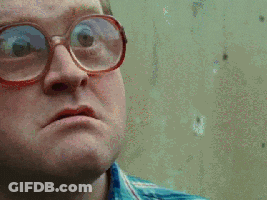 A Close Up Of A Man Wearing Glasses Making A Face GIF