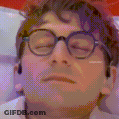 A Close Up Of A Man Wearing Glasses With His Eyes Closed . GIF