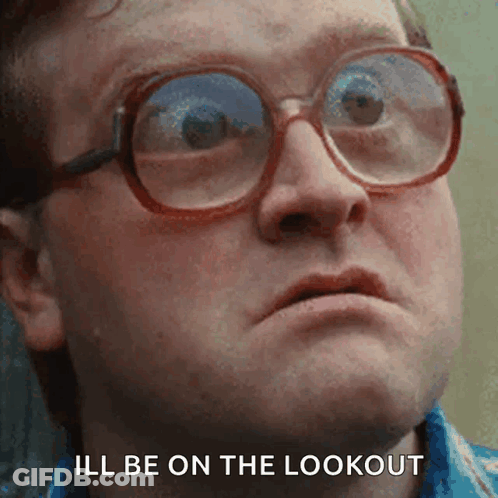 A Close Up Of A Man Wearing Glasses With The Words " Ill Be On The Lookout " Below Him GIF