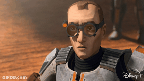 A Close Up Of A Man Wearing Goggles And A Disney + Logo GIF