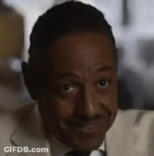 A Close Up Of A Man Wearing Headphones And A Suit And Tie . GIF