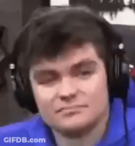 A Close Up Of A Man Wearing Headphones And Making A Funny Face . GIF