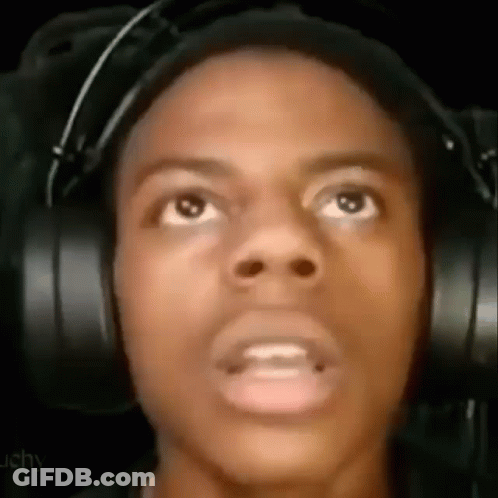 A Close Up Of A Man Wearing Headphones Making A Funny Face . GIF