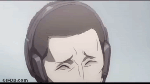 A Close Up Of A Man Wearing Headphones Making A Funny Face . GIF
