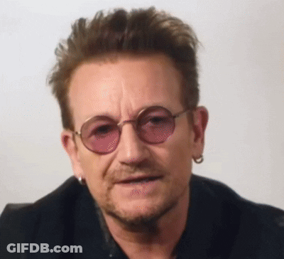 A Close Up Of A Man Wearing Sunglasses And A Black Jacket GIF