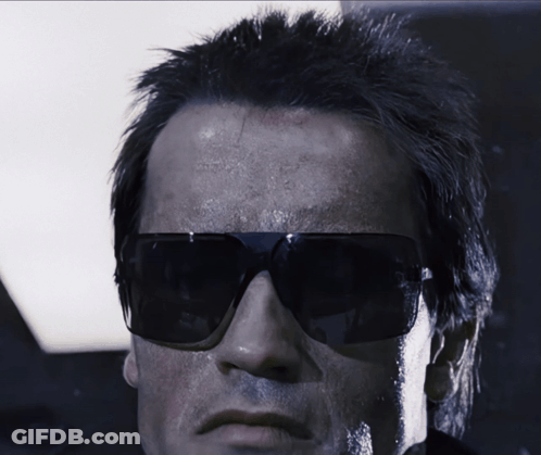 A Close Up Of A Man Wearing Sunglasses And A Black Jacket GIF