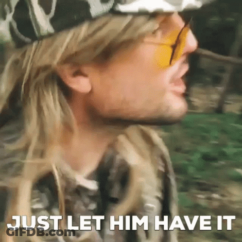 A Close Up Of A Man Wearing Sunglasses And A Hat With The Words `` Just Let Him Have It '' Written On It . GIF