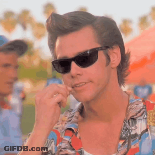 A Close Up Of A Man Wearing Sunglasses And A Shirt GIF