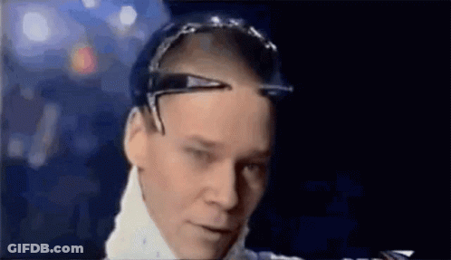 A Close Up Of A Man Wearing Sunglasses And A White Shirt . GIF