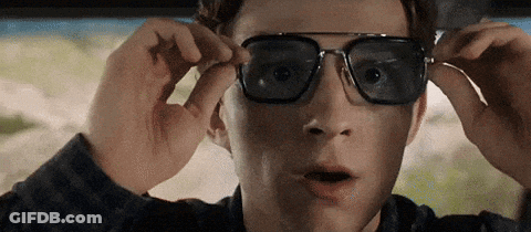 A Close Up Of A Man Wearing Sunglasses In A Car With A Surprised Look On His Face . GIF