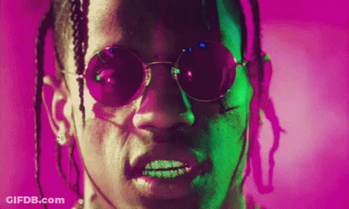 A Close Up Of A Man Wearing Sunglasses On A Purple Background . GIF