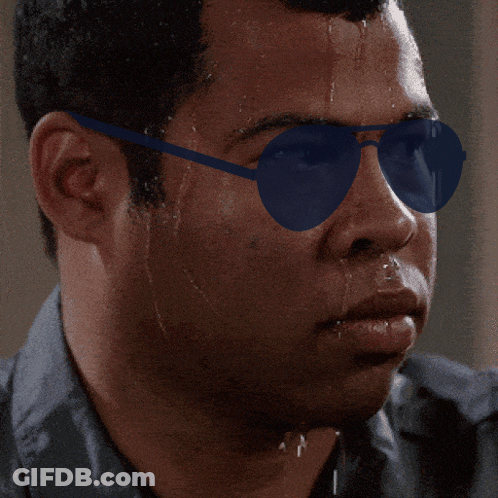 A Close Up Of A Man Wearing Sunglasses With Sweat Coming Out Of His Face GIF