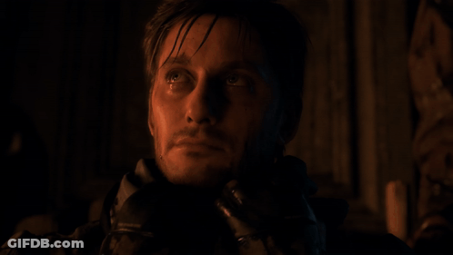 A Close Up Of A Man With A Bandana Around His Head GIF