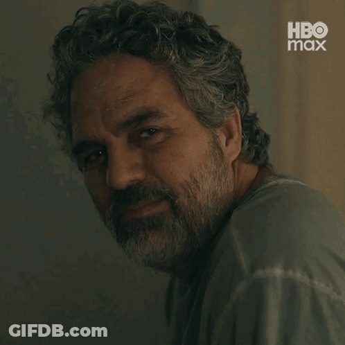 A Close Up Of A Man With A Beard And A Hbo Max Logo GIF