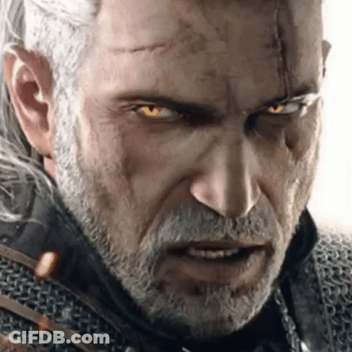 A Close Up Of A Man With A Beard And Glowing Yellow Eyes . GIF