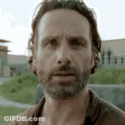 A Close Up Of A Man With A Beard And Long Hair . GIF