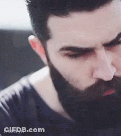 A Close Up Of A Man With A Beard And Mustache . GIF