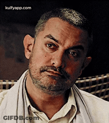 A Close Up Of A Man With A Beard And Mustache Making A Serious Face . GIF