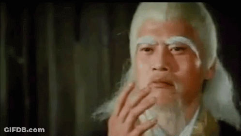 A Close Up Of A Man With A Beard And White Hair . GIF