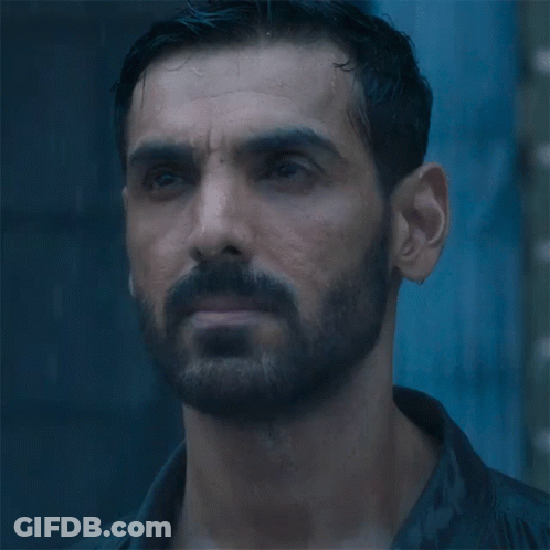 A Close Up Of A Man With A Beard GIF