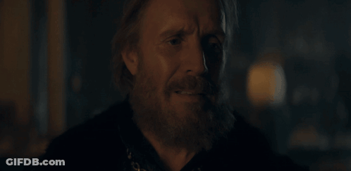 A Close Up Of A Man With A Beard Looking Down GIF