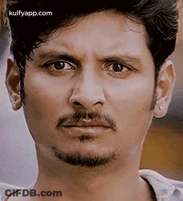 A Close Up Of A Man With A Beard Making A Funny Face . GIF