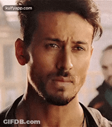 A Close Up Of A Man With A Beard Making A Sad Face . GIF