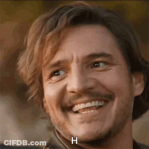 A Close Up Of A Man With A Beard Smiling With The Letter H Written On His Face . GIF