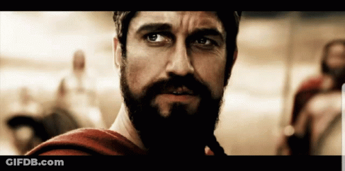 A Close Up Of A Man With A Beard GIF