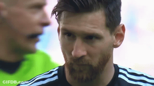 A Close Up Of A Man With A Beard Wearing A Black Adidas Shirt GIF