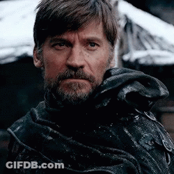 A Close Up Of A Man With A Beard Wearing A Black Coat GIF