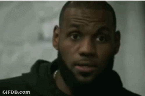 A Close Up Of A Man With A Beard Wearing A Black Hoodie GIF