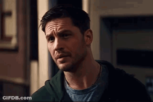 A Close Up Of A Man With A Beard Wearing A Green Hoodie And A Grey T-Shirt . GIF