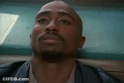 A Close Up Of A Man With A Beard Wearing A Leather Jacket And A White Shirt . GIF