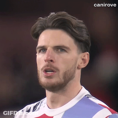 A Close Up Of A Man With A Beard Wearing A Soccer Jersey . GIF