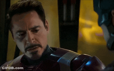 A Close Up Of A Man With A Beard Wearing A Superhero Suit GIF