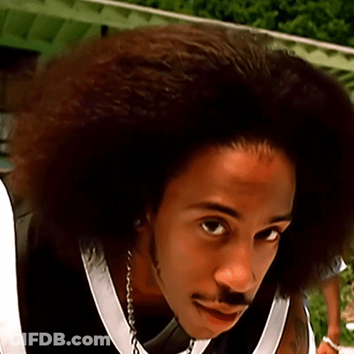 A Close Up Of A Man With A Big Afro GIF