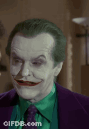 A Close Up Of A Man With A Joker Costume On GIF