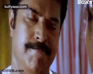 A Close Up Of A Man With A Mustache Making A Face . GIF
