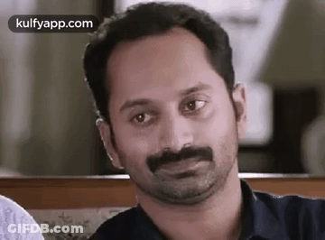 A Close Up Of A Man With A Mustache Making A Funny Face . GIF