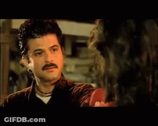 A Close Up Of A Man With A Mustache Making A Funny Face GIF